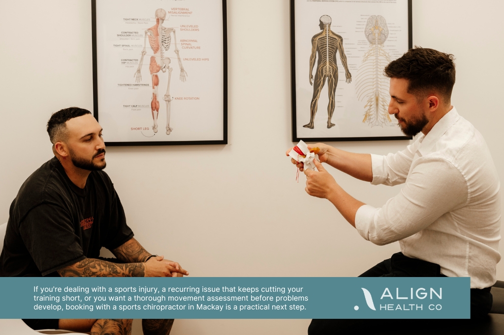 Chiropractor explaining a spine assessment to a patient at Align Health Co in Mackay